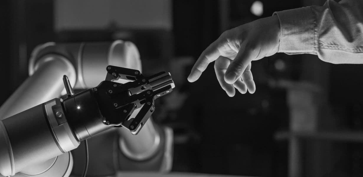 Person touching robotic arm